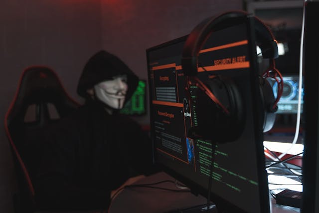 hacker wearing a smiling facemask